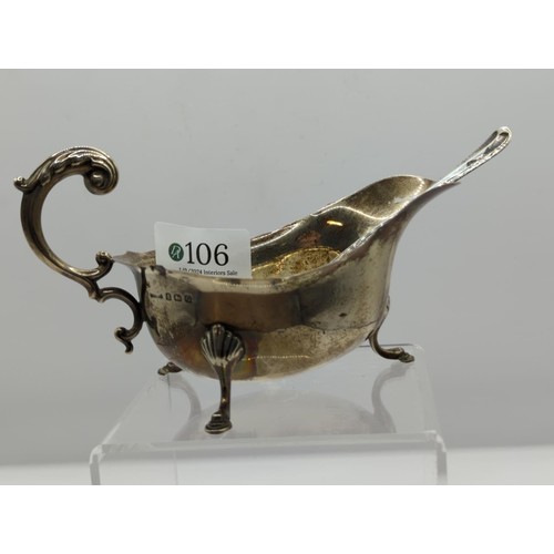 106 - Silver sauce boat together with a silver fruit spoon; sauce boat Birmingham 1931, makers mark rubbed... 