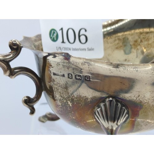 106 - Silver sauce boat together with a silver fruit spoon; sauce boat Birmingham 1931, makers mark rubbed... 