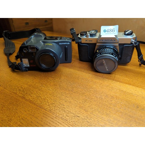 486 - Pentax K1000 camera body with 2 extra lenses & accessories plus a Zoom slide duplicator & an... 