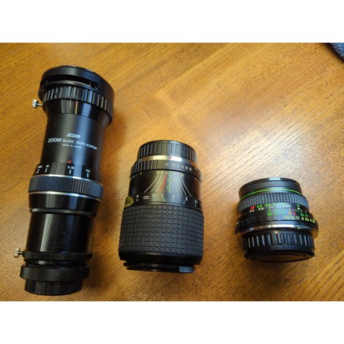 486 - Pentax K1000 camera body with 2 extra lenses & accessories plus a Zoom slide duplicator & an... 