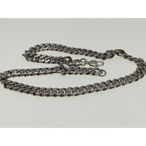 61 - Silver flat curb linkchain, length 55 cms, wt 147 gms