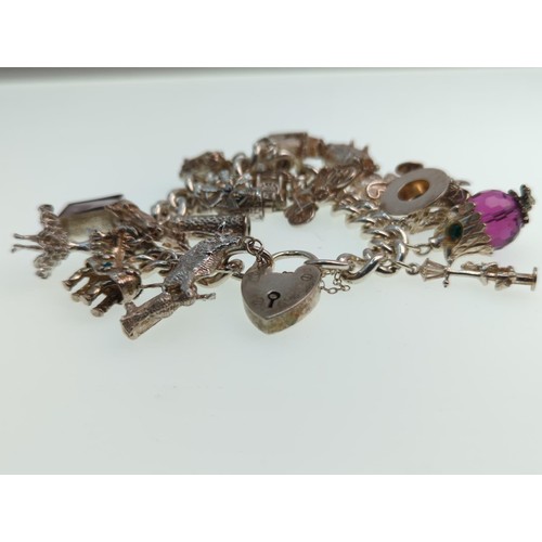 62 - Silver charm bracelet , wt 122 gms