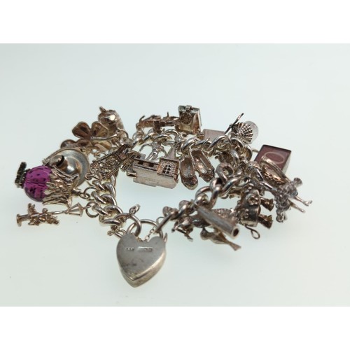 62 - Silver charm bracelet , wt 122 gms