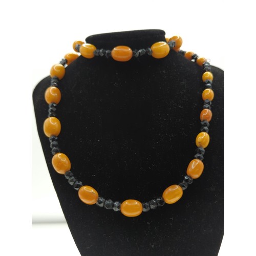 70 - Amber and black bead necklace Approx L780mm approx 54g