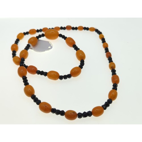 70 - Amber and black bead necklace Approx L780mm approx 54g