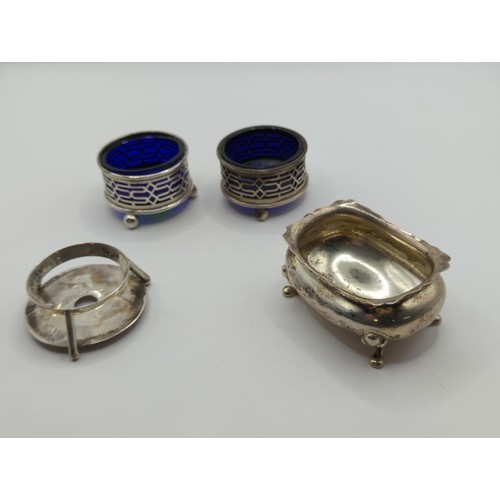 99 - Pair of silver blue glass lined salts, an oval salt (lacking liner) and an egg holder (personalised)... 