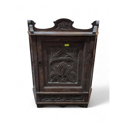 540 - Small oak carved cabinet with small lower drawer. W50cm D19cm H58cm