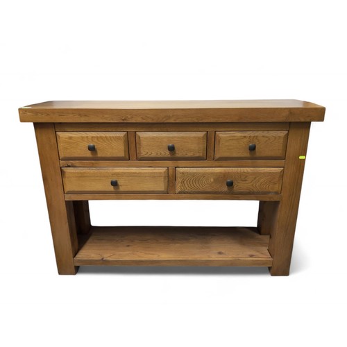 541 - Solid oak 5 drawer sideboard. W130cm D36cm H85cm