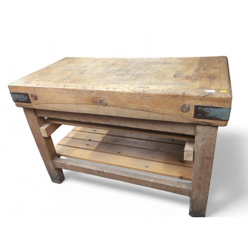 555 - 4ft vintage wooden butchers block, with natural patina and wear, with areas of professional repair, ... 