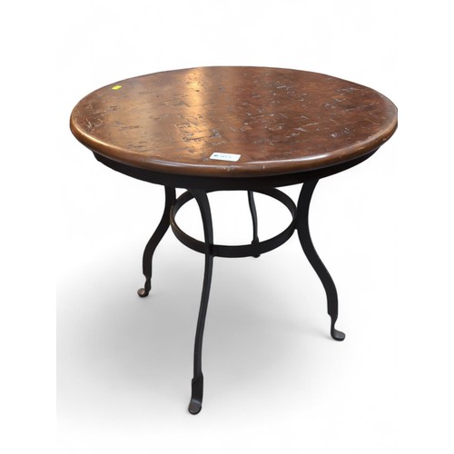 565 - Wrought metal based table with circular lattice wood top. D60cm H61cm