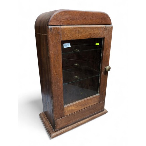 572 - Early C20 oak dome topped display cabinet, with 2 later glass shelves. W41cm D24cm H74cm