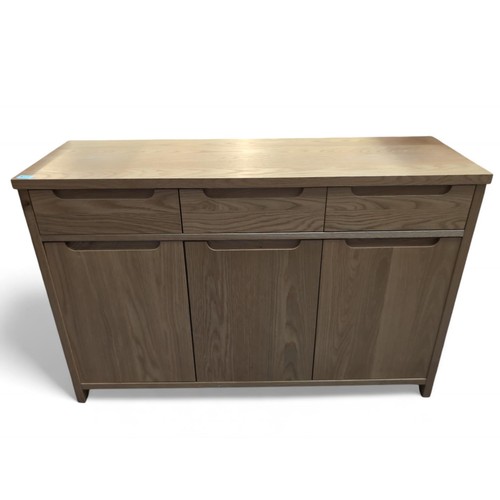 573 - Light oak effect sideboard. 3 upper drawers over 3 cupboards. W121cm D40cm H79cm