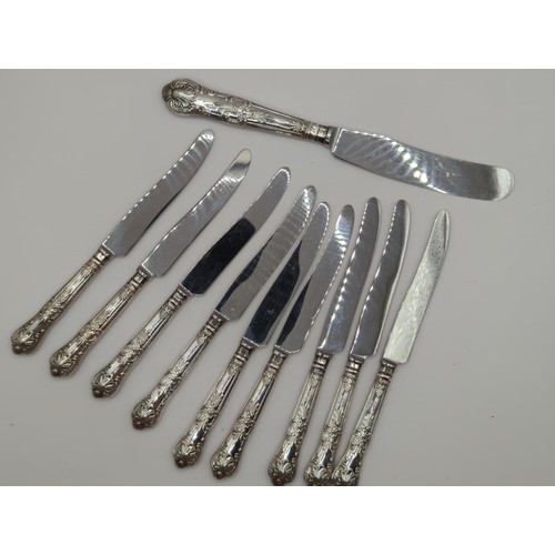 124 - Silver sugar nips, 9 silver handled cake knives, 6 dessert forks , 3 cake forks plus small & lar... 