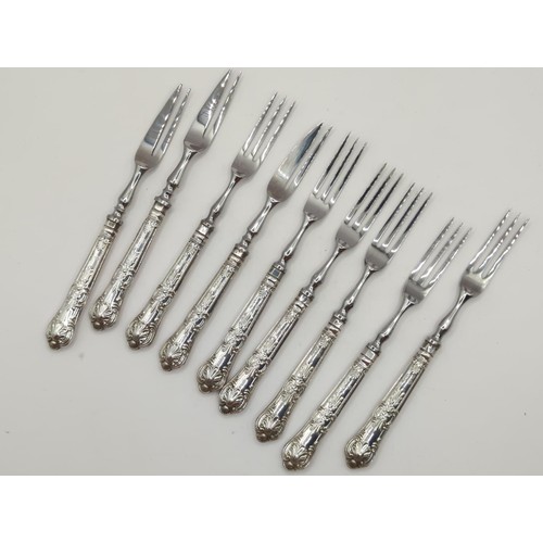 124 - Silver sugar nips, 9 silver handled cake knives, 6 dessert forks , 3 cake forks plus small & lar... 