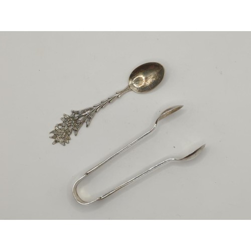 124 - Silver sugar nips, 9 silver handled cake knives, 6 dessert forks , 3 cake forks plus small & lar... 