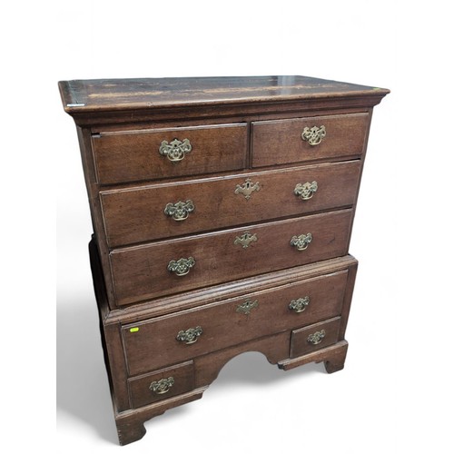 556 - Georgian oak tallboy chest on chest. 7 drawers raised on bracket supports. W98cm D54cm H121cm