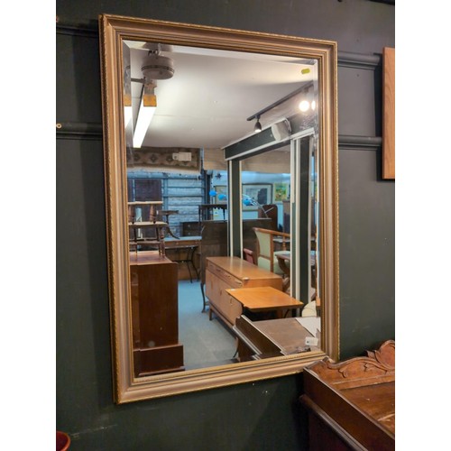 535 - Gilt framed mirror. W64cm L94cm