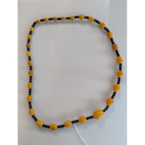 70 - Amber and black bead necklace Approx L780mm approx 54g