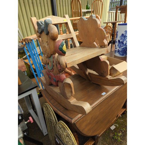 106 - Child's hardwood teddybear carved rocking chair, damage to one teddy's arm