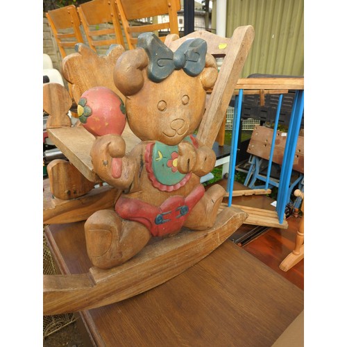 106 - Child's hardwood teddybear carved rocking chair, damage to one teddy's arm