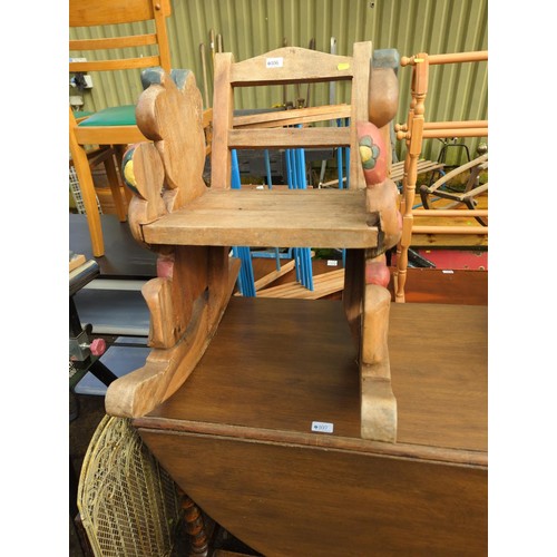 106 - Child's hardwood teddybear carved rocking chair, damage to one teddy's arm