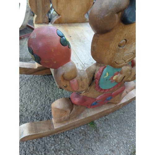 106 - Child's hardwood teddybear carved rocking chair, damage to one teddy's arm