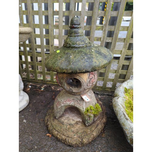 15 - Oriental concrete garden feature in 4 pieces. Overall height 54cm.