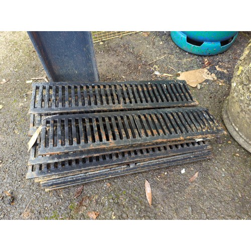 18 - 11 metal drain covers. 50cm by 12cm each.