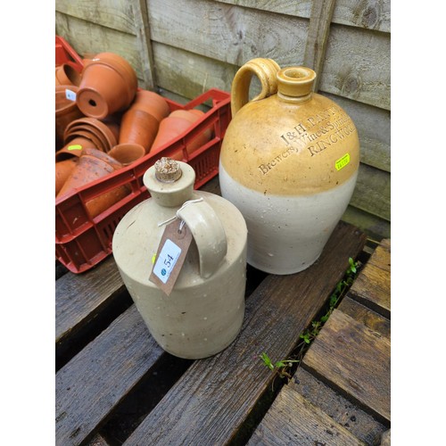 54 - 2 stoneware jars. One marked J & H Panton, Ringwood. Height of largest jar 29cm.