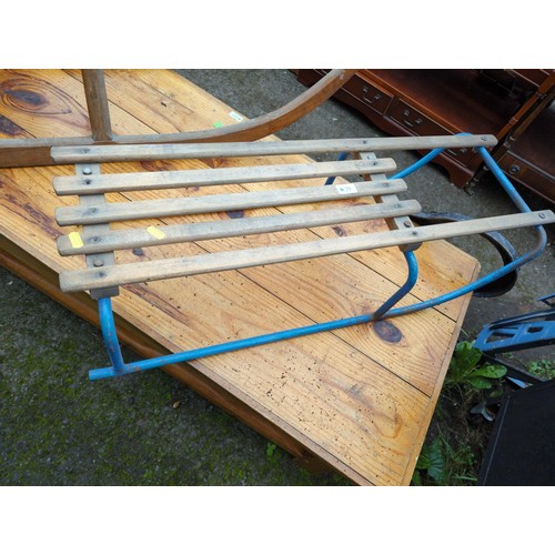 79 - Tri-ang wooden and metal toboggan. L91cm.