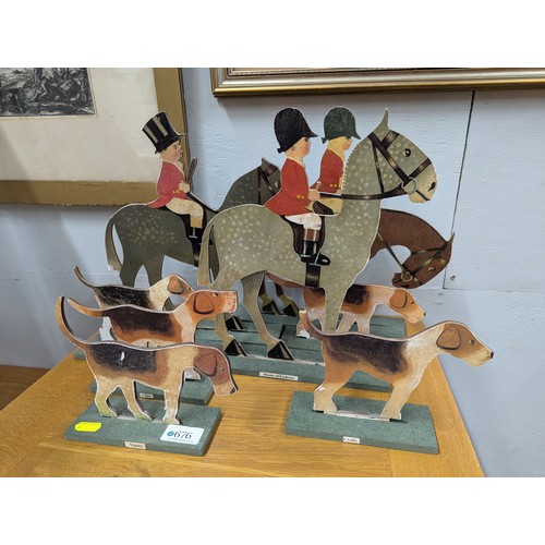 676 - Model cut-out hunt scene inc. three riders and five hounds, riders ht.31cm