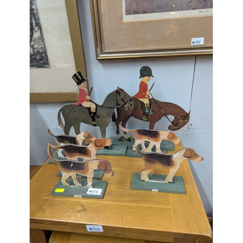 676 - Model cut-out hunt scene inc. three riders and five hounds, riders ht.31cm