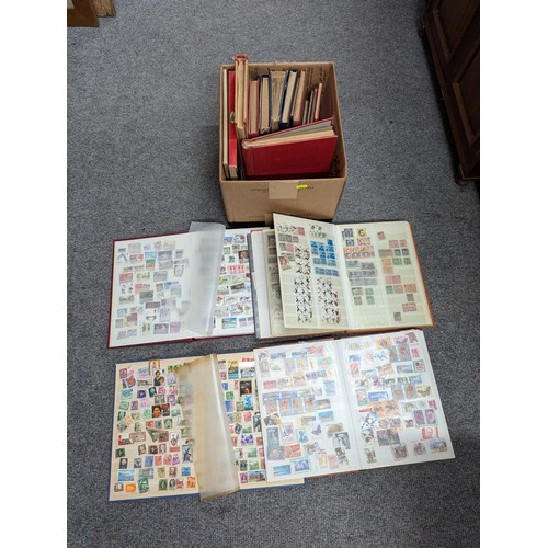 683 - Box of partly filled stamp albums, eighteen in total