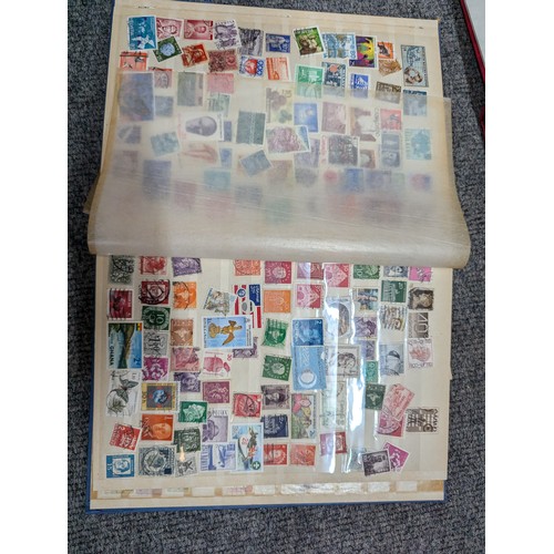 683 - Box of partly filled stamp albums, eighteen in total