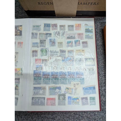 683 - Box of partly filled stamp albums, eighteen in total