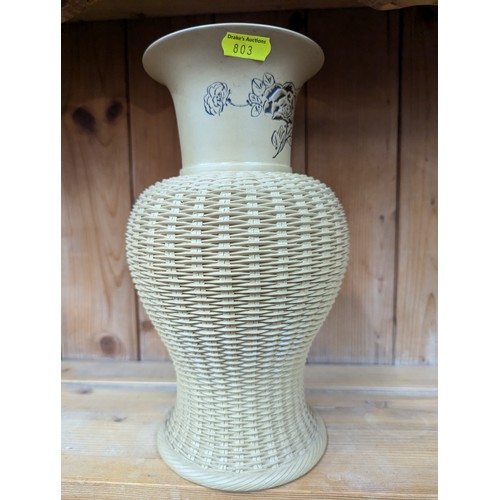 687 - Oriental vase with rattan effectHt 26 x diam 15 cms