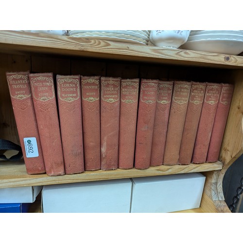 692 - Twelve volumes of Odhams Press Classic Literature inc. Gulliver's Travels, Uncle Tom's Cabin etc.