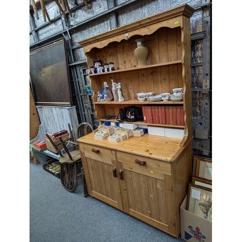 766 - Pine open faced dresser, with 2 drawers & 2 cupboards. W118cm d55cm h198cm