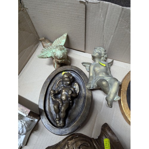 698 - Eight decorative plaster pieces inc. cherub sconces and mirror etc.