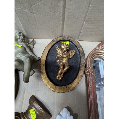 698 - Eight decorative plaster pieces inc. cherub sconces and mirror etc.