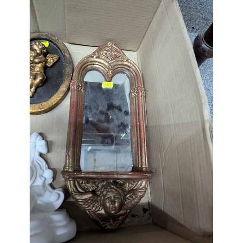 698 - Eight decorative plaster pieces inc. cherub sconces and mirror etc.