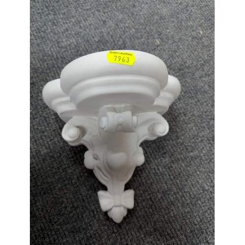 698 - Eight decorative plaster pieces inc. cherub sconces and mirror etc.