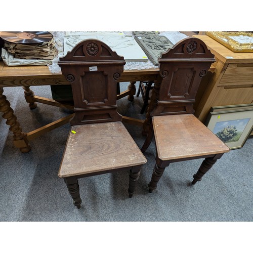 777 - Pair of early c20 mahogany hall chairs