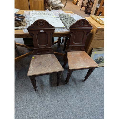 777 - Pair of early c20 mahogany hall chairs