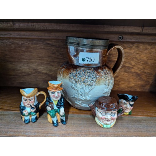 710 - Hunting scene jug together with four mini character jugs