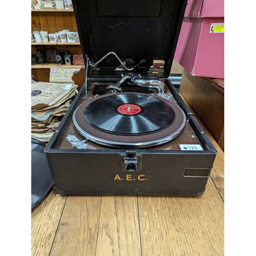 719 - HMV portable gramophone together with a selection of gramophone records