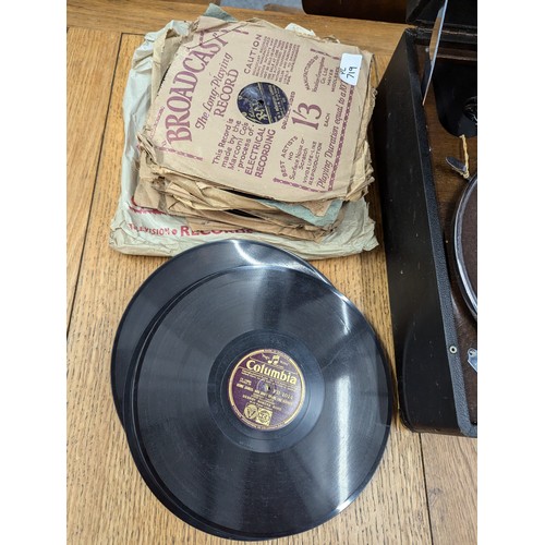 719 - HMV portable gramophone together with a selection of gramophone records