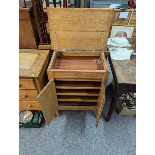 787 - Light oak cupboard with lift top storage and four internal shelves W57 x D38 X H77.5CM