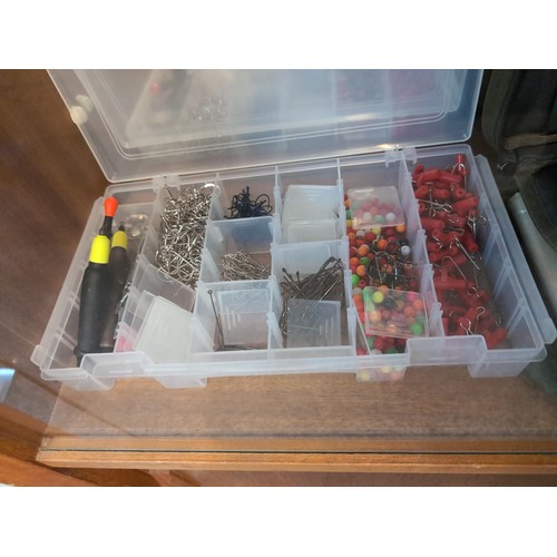 823 - Fishing weights, hooks and lures in cabinet over three shelves