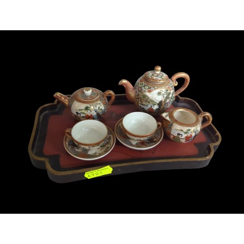 394 - Miniature Japanese  tea set on laquered tray, missing one lid